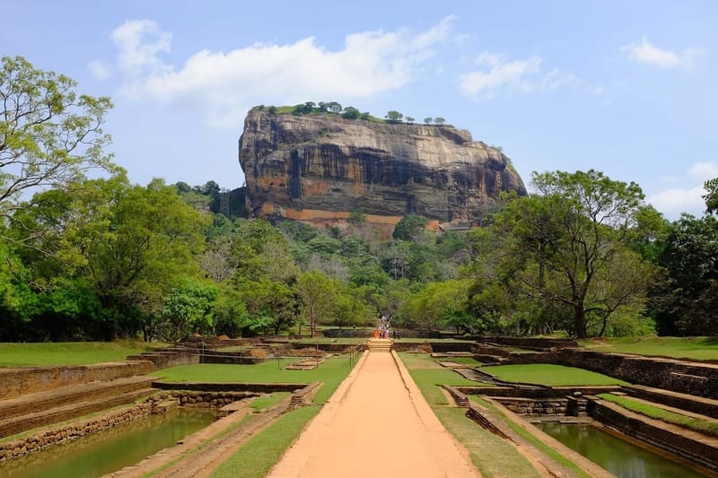 Sigiriya rock fortress rising above the surrounding forest canopy in central Sri Lanka