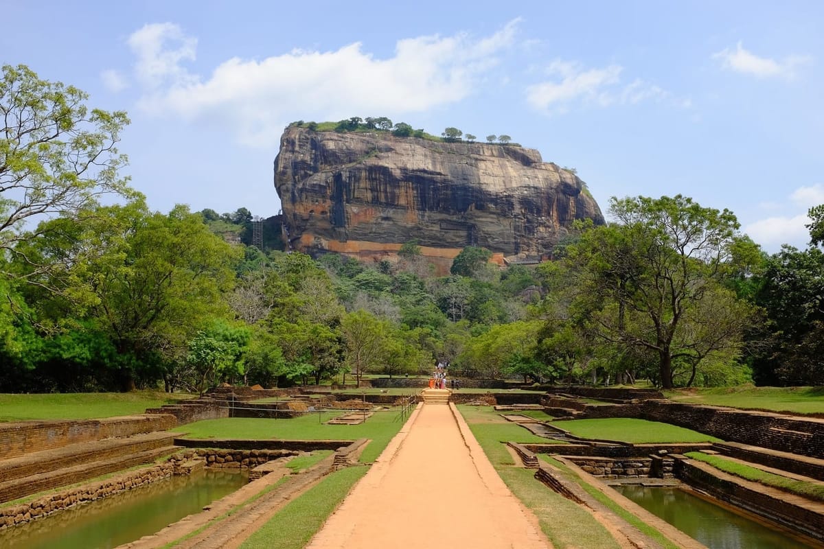 Sigiriya rock fortress rising above the surrounding forest canopy in central Sri Lanka